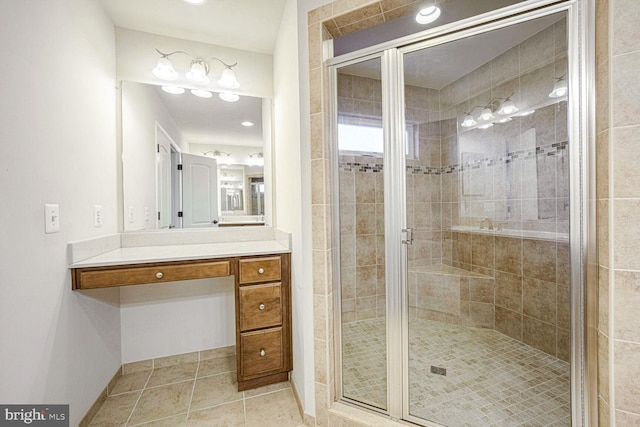 bathroom with walk in shower, tile patterned floors, and vanity