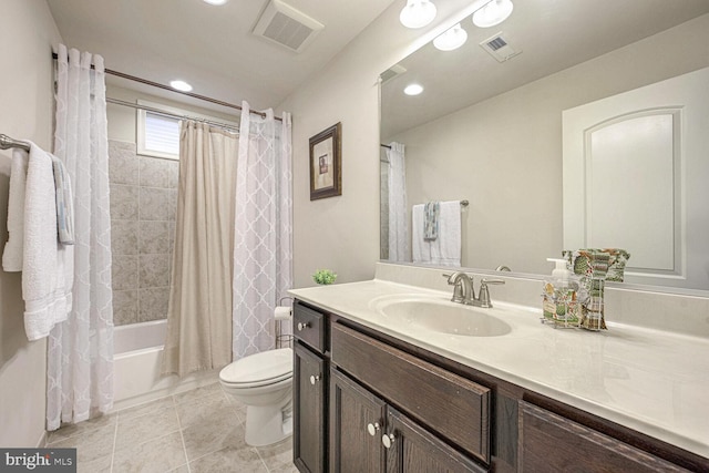 full bathroom with vanity, shower / tub combo, and toilet