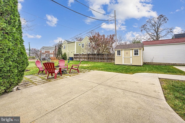 view of patio featuring a fire pit and a shed