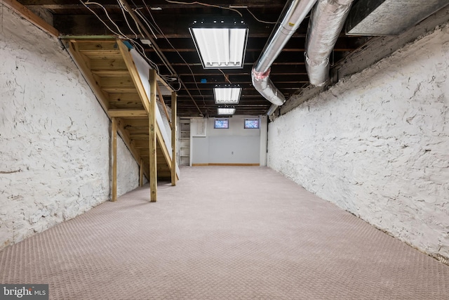 basement featuring carpet flooring