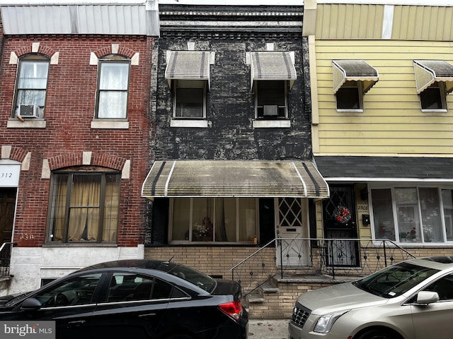 view of front facade featuring cooling unit