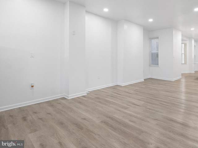 spare room with light hardwood / wood-style flooring