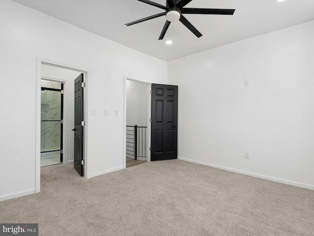 unfurnished bedroom featuring ceiling fan and light carpet