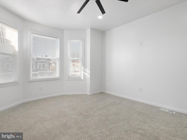 unfurnished room featuring carpet and ceiling fan