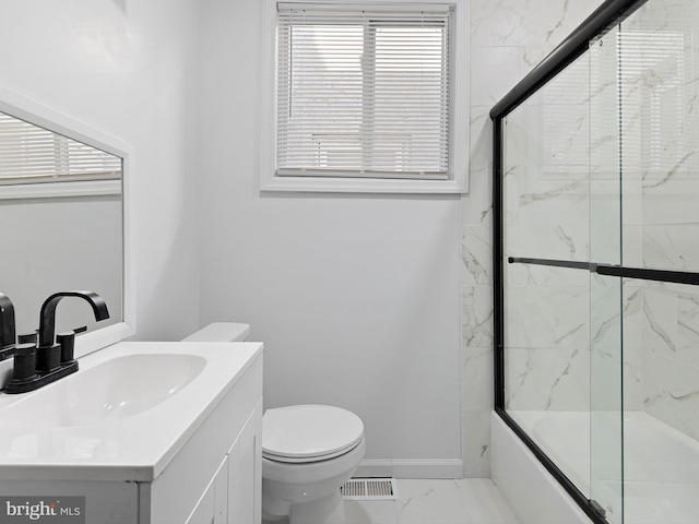 full bathroom with vanity, toilet, and enclosed tub / shower combo