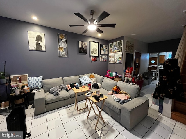 tiled living room with ceiling fan