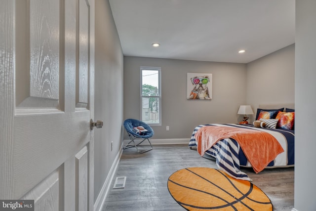 bedroom with wood-type flooring