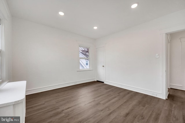 empty room featuring dark hardwood / wood-style flooring