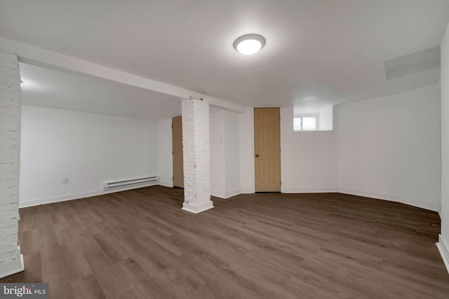 basement with hardwood / wood-style floors and a baseboard radiator