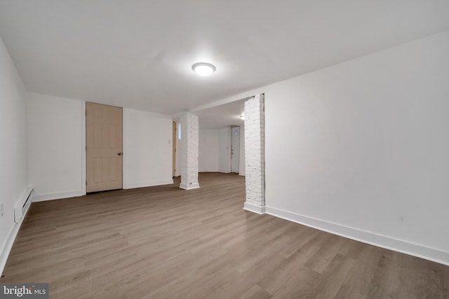 spare room featuring light hardwood / wood-style floors and baseboard heating