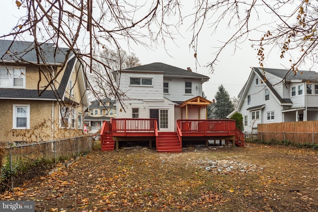 back of house featuring a deck