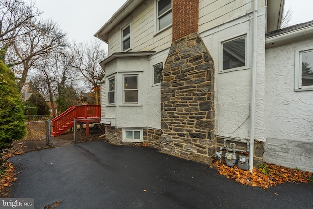 view of property exterior with a patio