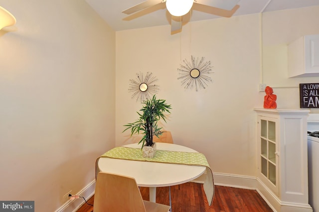 dining area with dark hardwood / wood-style floors and ceiling fan