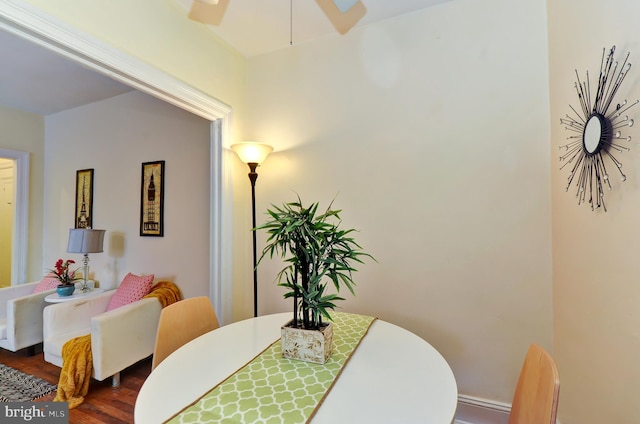 dining space with dark wood-type flooring