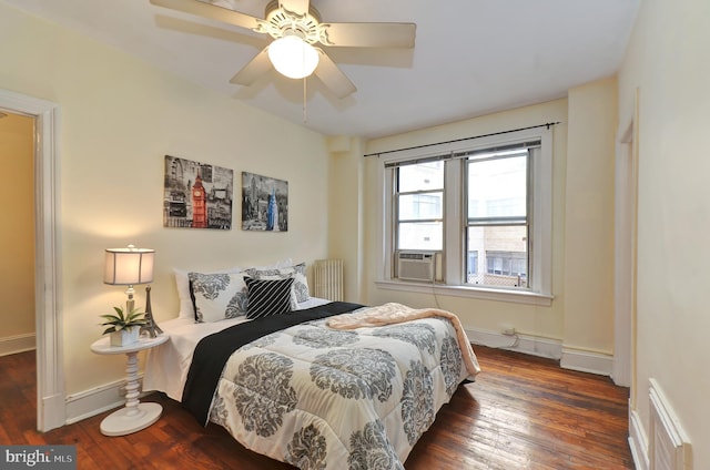 bedroom with ceiling fan, cooling unit, radiator heating unit, and dark wood-type flooring