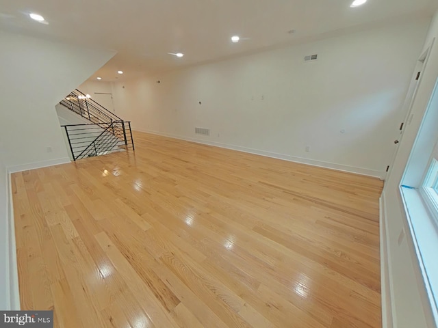 unfurnished living room with light hardwood / wood-style flooring