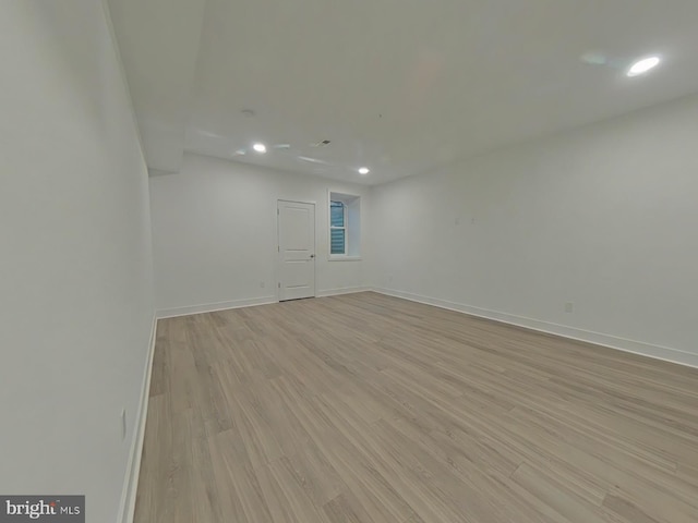 spare room featuring light hardwood / wood-style floors