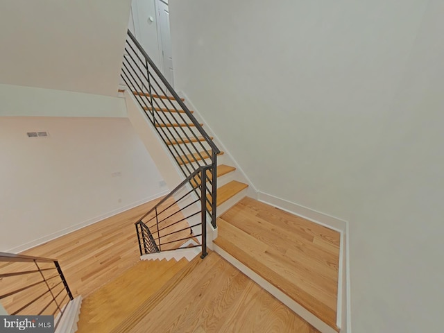 stairway with wood-type flooring