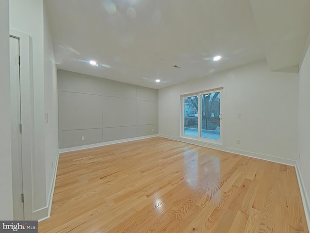 spare room featuring light wood-type flooring