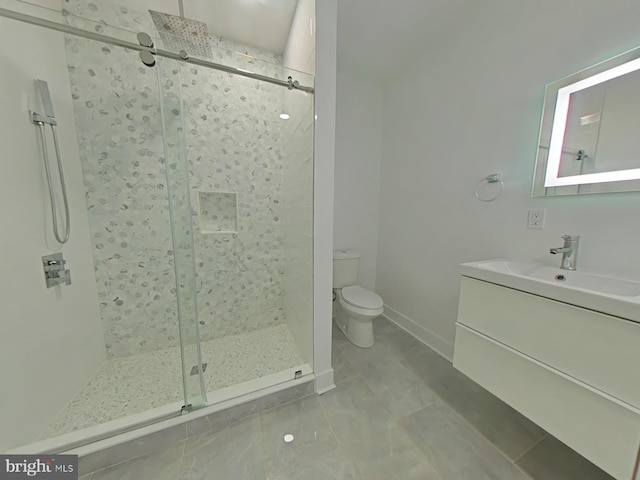 bathroom with walk in shower, vanity, and toilet