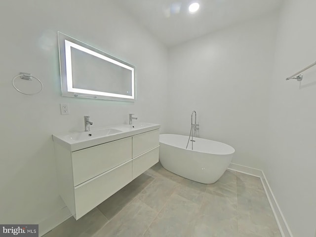 bathroom with a tub to relax in and vanity