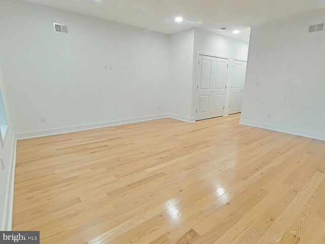 unfurnished room with light hardwood / wood-style flooring