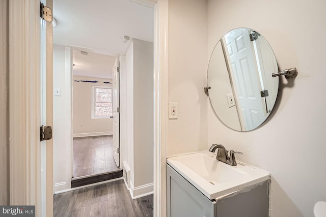 bathroom featuring vanity and wood-type flooring