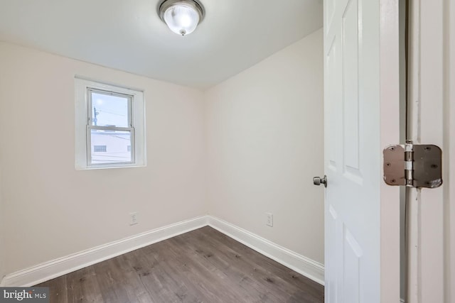 unfurnished room with hardwood / wood-style flooring