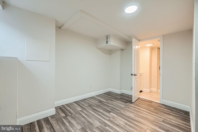 basement featuring wood-type flooring