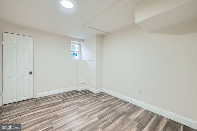 basement featuring light hardwood / wood-style flooring