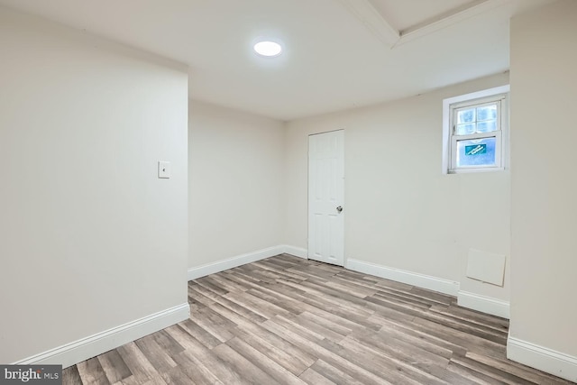 unfurnished room with light wood-type flooring