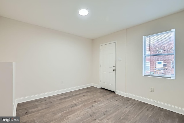 spare room with light wood-type flooring