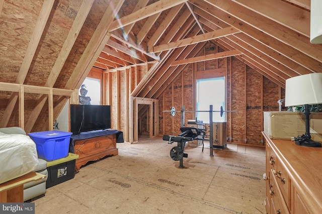 attic featuring a healthy amount of sunlight