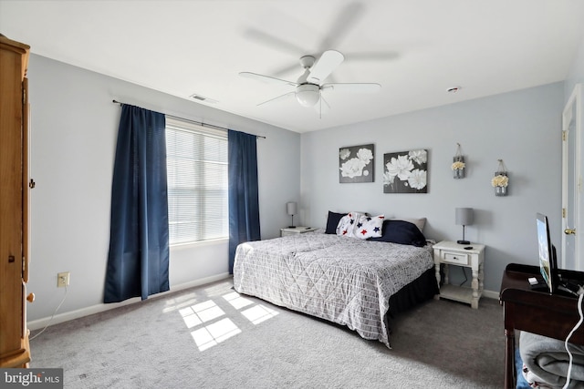 bedroom with ceiling fan and carpet floors