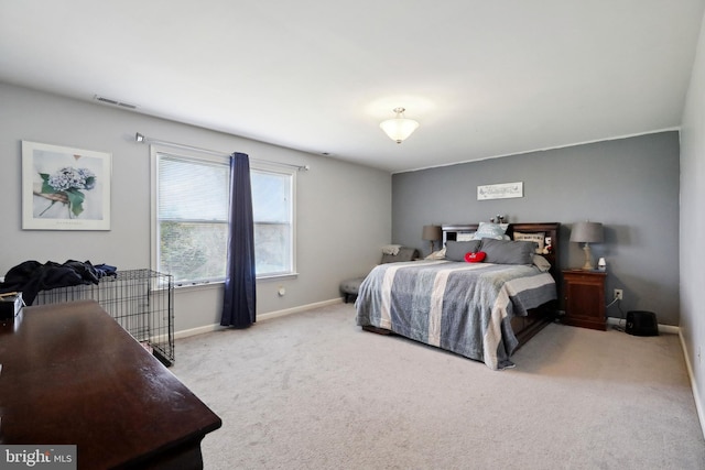 bedroom featuring light colored carpet