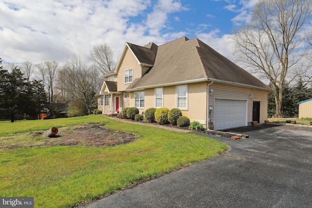 view of side of home featuring a yard and a garage