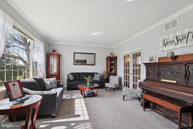 living room with carpet, french doors, and ornamental molding