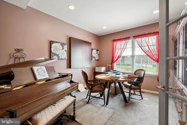 dining space with light carpet