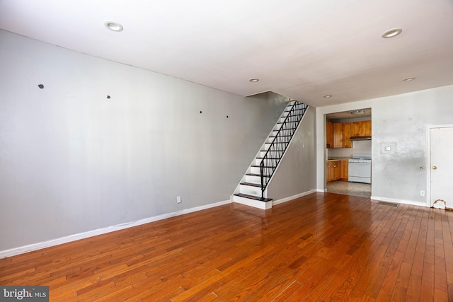 unfurnished living room with hardwood / wood-style flooring