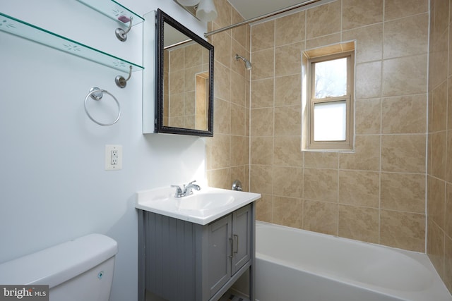 full bathroom featuring shower / bathing tub combination, vanity, and toilet