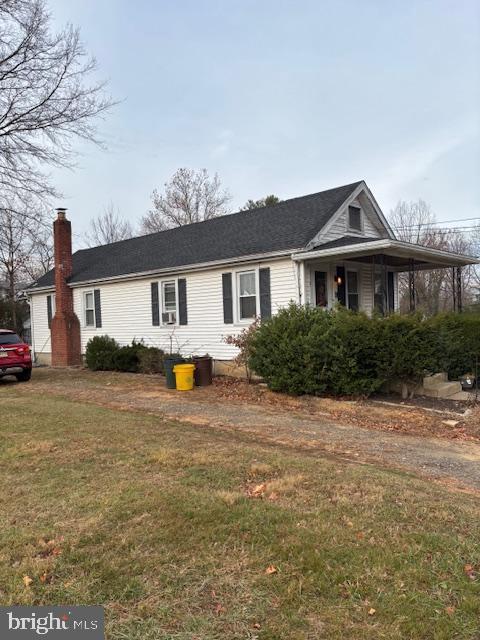 11 Heath St, Trenton, NJ 08638 - view of front of home featuring a front yard and a chimney