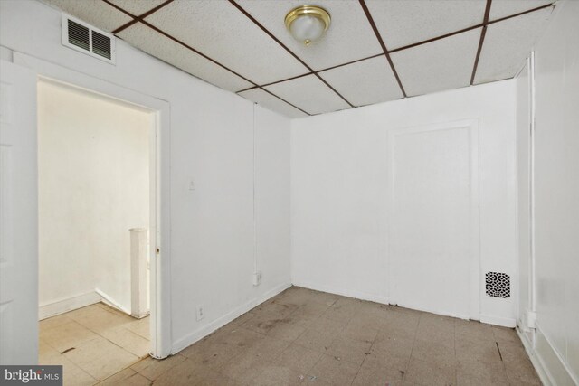 2048 S Croskey St, Philadelphia, PA 19145 - empty room with a paneled ceiling, tile patterned floors, and baseboards