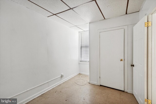 2048 S Croskey St, Philadelphia, PA 19145 - unfurnished bedroom featuring a paneled ceiling, tile patterned floors, and baseboards