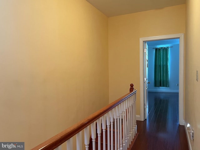 corridor with dark hardwood / wood-style floors