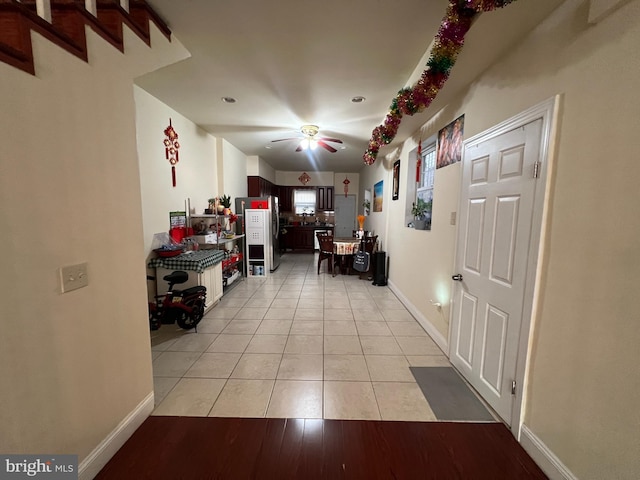 corridor with light tile patterned flooring