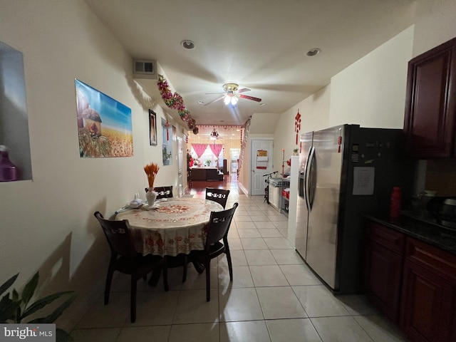 tiled dining area featuring ceiling fan