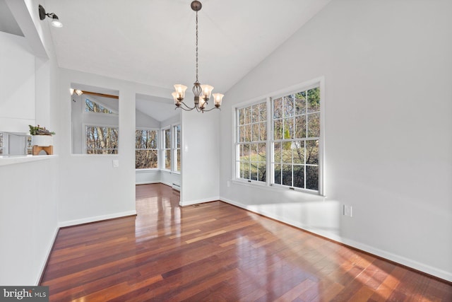 unfurnished dining area with a chandelier, dark hardwood / wood-style flooring, and lofted ceiling