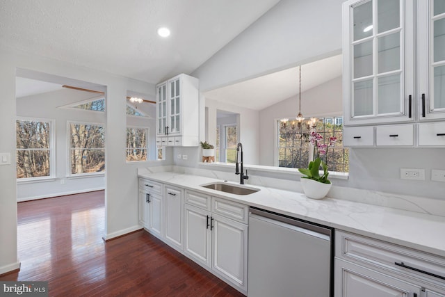 kitchen featuring dishwasher, a healthy amount of sunlight, and lofted ceiling