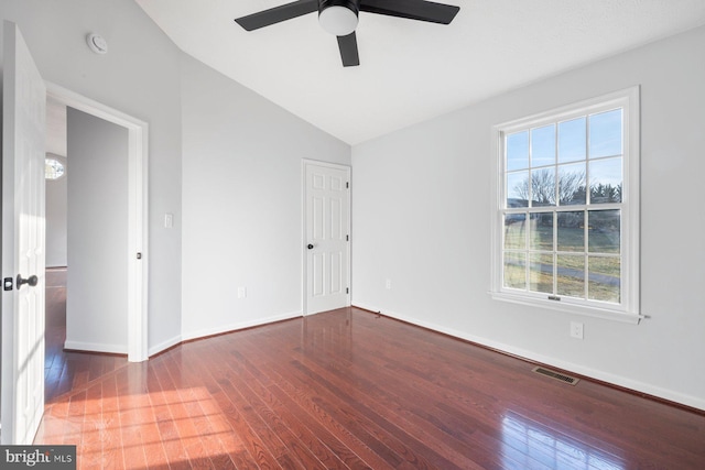 spare room with ceiling fan, dark hardwood / wood-style flooring, and lofted ceiling