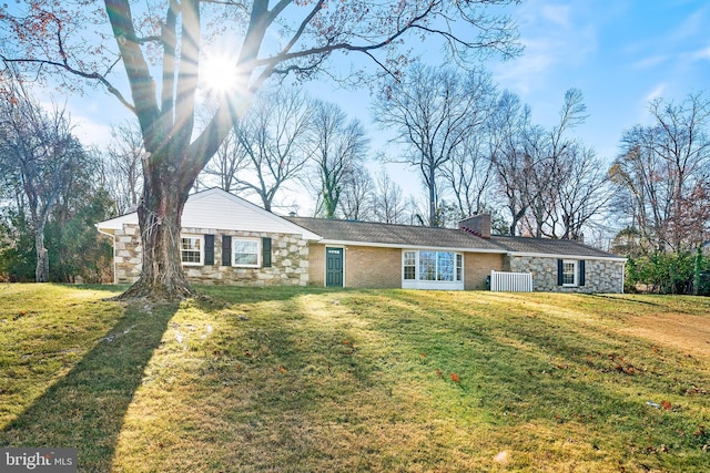 ranch-style house with a front yard